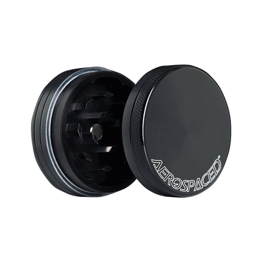 An open black 2 piece Aerospaced grinder.